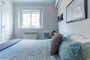 A bed or beds in a room at Casa la Fontana - Hostatel