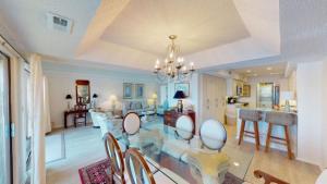 a dining room and living room with a dining table at Osprey Watch 4D in Pawleys Island