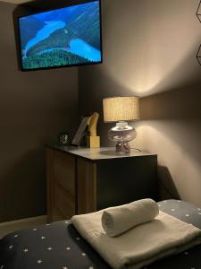 A television and/or entertainment centre at Beta House Apartments