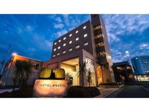 a building with a sign in front of it at Hotel AreaOne Minamisoma - Vacation STAY 56242v in Minamisouma