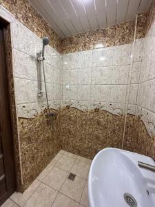 a bathroom with a shower and a sink at Sochiner Hotel in Vanadzor