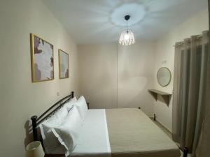 Ένα ή περισσότερα κρεβάτια σε δωμάτιο στο Maria’s Apartment