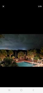 a picture of a swimming pool with a dark sky at Mallard in Jacksonville