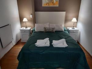 Una cama o camas en una habitación de Kumen Apart de Playa