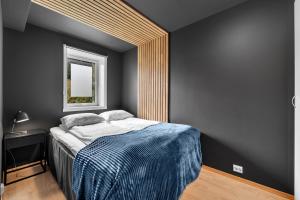 Tempat tidur dalam kamar di Arctic Homes - Premium Plaza