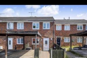 a large brick building with white windows and a driveway at Your Perfect Place to Relax in Havering atte Bower