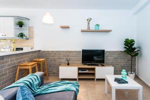 TV a/nebo společenská místnost v ubytování Casa Volcán y Mar