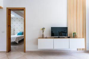 TV a/nebo společenská místnost v ubytování Casa Volcán y Mar