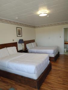 Postel nebo postele na pokoji v ubytování Tantramar Motel