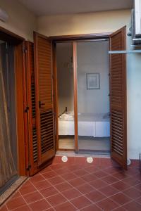 Posteľ alebo postele v izbe v ubytovaní Corallo holiday house Acitrezza