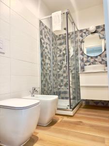a bathroom with a toilet and a shower at B&B Cellini in Santa Maria di Castellabate