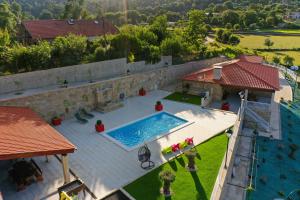 an overhead view of a swimming pool on a house at Casa do Sabugueiro in Ponte de Lima