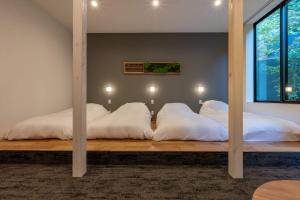 Rúm í herbergi á Bessho Onsen Midoriya