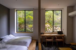 Rúm í herbergi á Bessho Onsen Midoriya
