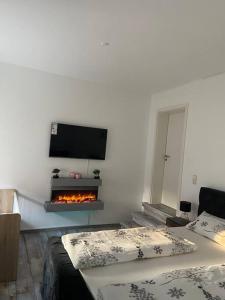 a living room with a fire place in the wall at Bronzetaler in Bad Harzburg