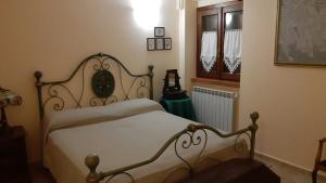 מיטה או מיטות בחדר ב-La Casa di Linda