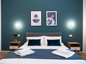 Postel nebo postele na pokoji v ubytování Moor Assarotti Suites - Genova City Center