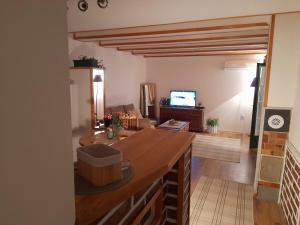 a living room with a large wooden counter top at Bajka in Valjevo