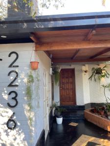 a house with a number on the side of it at Lomas del Paraná in Eldorado