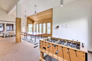 a large kitchen with a stove and a table at Ski-InandSki-Out Brian Head Condo with Hot Tub! in Brian Head