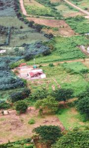 an aerial view of a house in a field at Cerro Beach in Sinchal