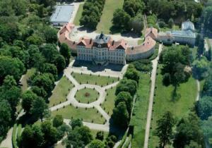 an aerial view of a large house with trees at BIAŁY DOMEK w Puszczykowie in Puszczykowo