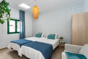 Postel nebo postele na pokoji v ubytování Casa Volcán y Mar