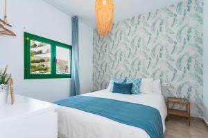 Postel nebo postele na pokoji v ubytování Casa Volcán y Mar + 37 fotografií