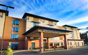 a building with a sign that reads spartan village village at SpringHill Suites by Marriott Bend in Bend