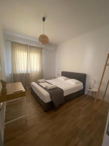 A bed or beds in a room at Menta House