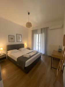 A bed or beds in a room at Menta House