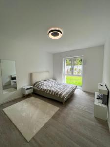 Postel nebo postele na pokoji v ubytování Luxuriöses Apartment für 4 Personen, Neubau, Parkplatz free