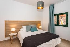 Postel nebo postele na pokoji v ubytování Casa Volcán y Mar