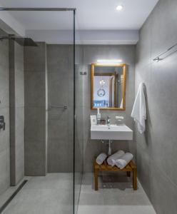 a bathroom with a sink and a shower at Melia Villas in Ierissos