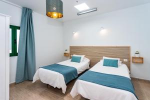 Postel nebo postele na pokoji v ubytování Casa Volcán y Mar
