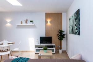 TV a/nebo společenská místnost v ubytování Casa Volcán y Mar