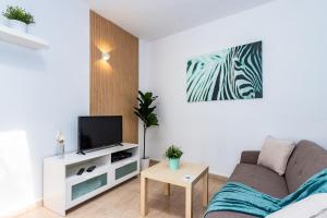 TV a/nebo společenská místnost v ubytování Casa Volcán y Mar