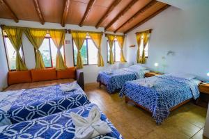 Postel nebo postele na pokoji v ubytování Galapagos Verde Azul