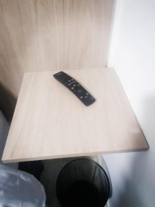 a remote control sitting on top of a table at Casa Hospedaje - H in Bogotá