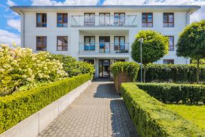 Vonkajšia záhrada v ubytovaní Beautiful Apartment Gdynia Czarnieckiego with Balcony by Noclegi Renters