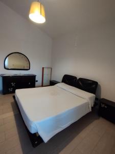 Tempat tidur dalam kamar di Casa vacanze via Brindisi