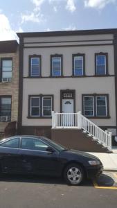 a black car parked in front of a building at Wonderful & Cozy Apartment Close to Time Square NYC in North Bergen