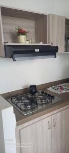 a kitchen with a stove top in a kitchen at Apartamento Amoblado Cartagena in Cartagena de Indias