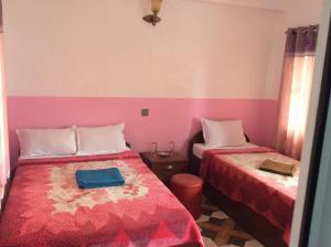 Postelja oz. postelje v sobi nastanitve Evergreen guest house