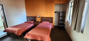 Postel nebo postele na pokoji v ubytování HOTEL POSADA DE LA MONEDA