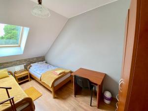 Llit o llits en una habitació de Gospodarstwo Agroturystyczne Zasadkowe Bory