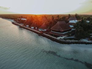 an aerial view of a resort on the water at Las Nubes de Holbox in Holbox Island