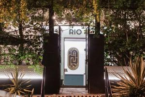a front door of a bus stop with the rio sign on it at RIO HOSTEL in Guatemala