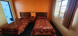 Postel nebo postele na pokoji v ubytování HOTEL POSADA DE LA MONEDA