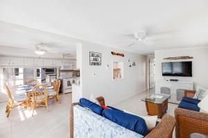 a living room with a couch and a table at Dock Holiday in Cudjoe Key